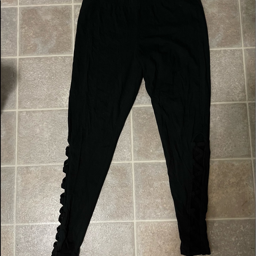 Torrid leggings with cross cross below the knee side peek a boo